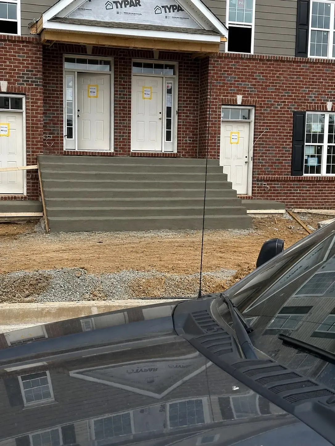 Finished cast concrete entrance stairs at a townhouse development